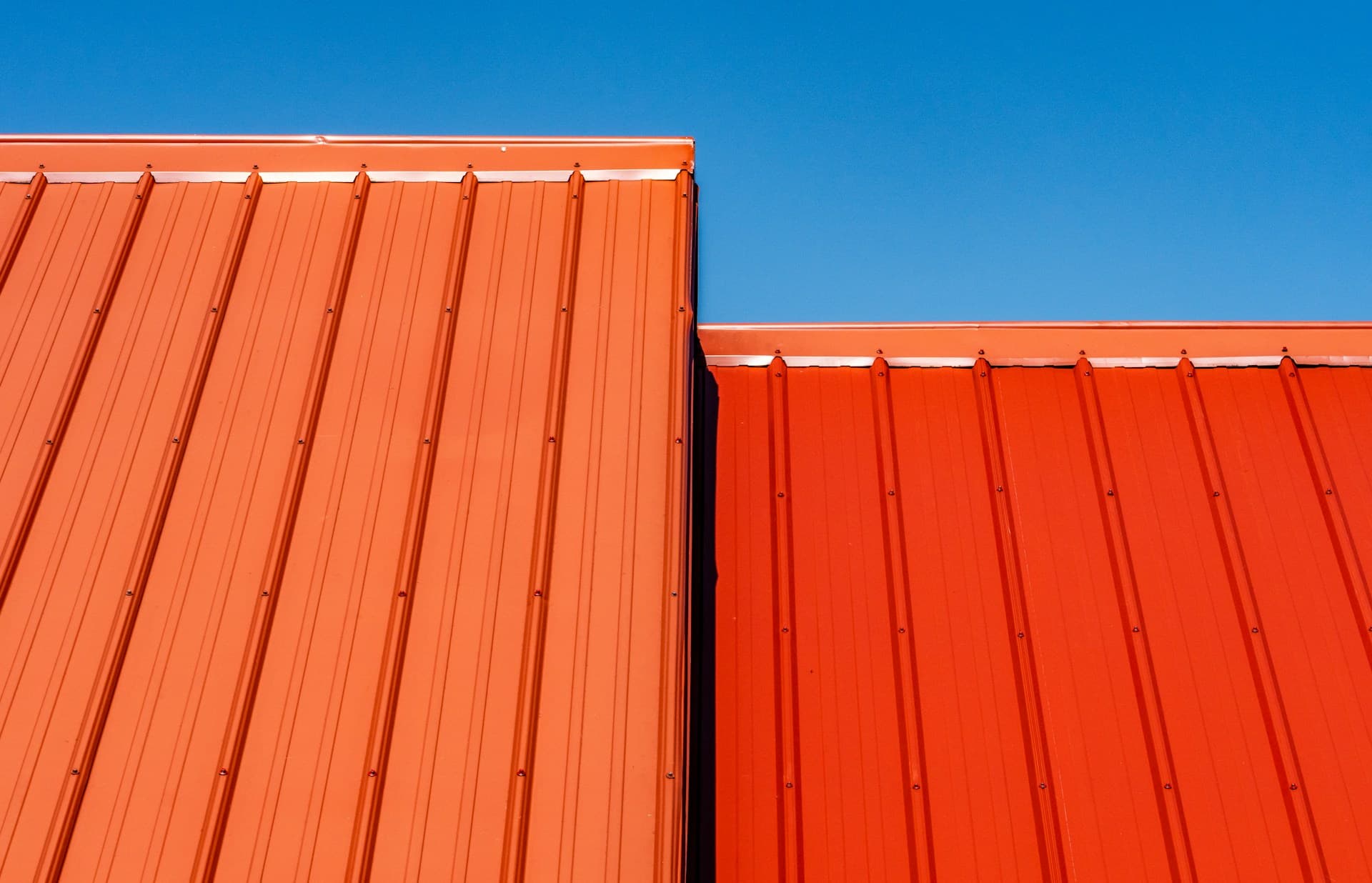Roofing — corrugated metal roof sheeting against a blue sky