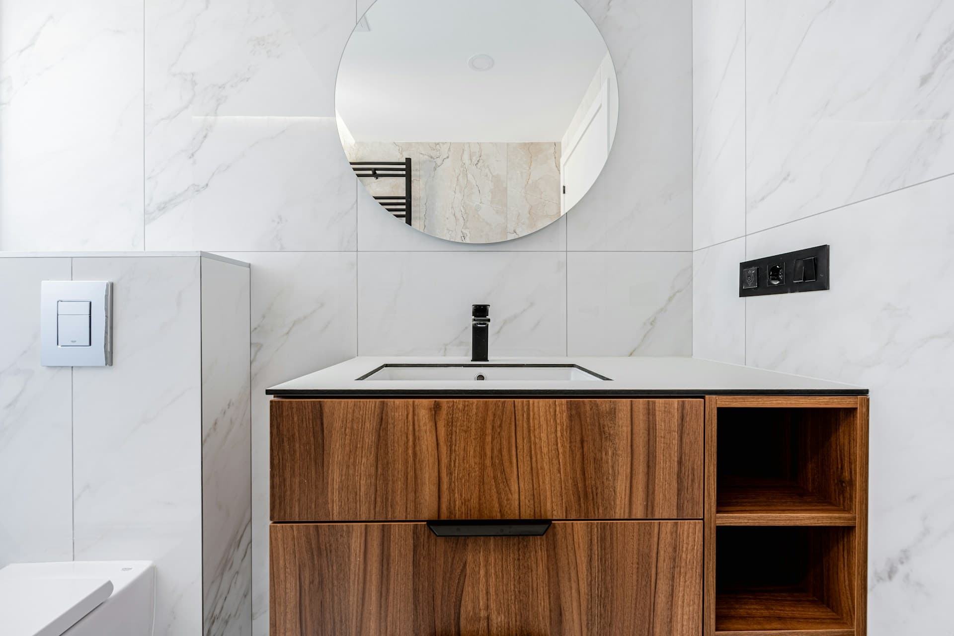 Tiling — a finished marble-tiled bathroom wall